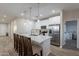 Modern kitchen island with seating and stainless steel appliances at 3515 N Tewa Cir, Eloy, AZ 85131