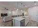 Open kitchen flows into living area, featuring island with seating at 3515 N Tewa Cir, Eloy, AZ 85131