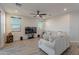 Living room with sectional sofa, flat-screen TV, and ceiling fan at 3515 N Tewa Cir, Eloy, AZ 85131