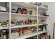 Well-stocked pantry with ample shelving for storage at 3515 N Tewa Cir, Eloy, AZ 85131