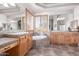 Double vanity bathroom with a soaking tub and wood cabinets at 36445 N 14Th St, Phoenix, AZ 85086