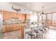 Modern kitchen with light wood cabinets and granite countertops at 36445 N 14Th St, Phoenix, AZ 85086