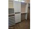 Large walk-in closet with built-in shelves and drawers at 36445 N 14Th St, Phoenix, AZ 85086