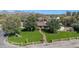 Aerial view of a charming home with a well-manicured front lawn and mature trees at 4022 E Stanford Dr, Phoenix, AZ 85018