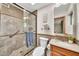 Bathroom featuring a glass door shower and stylish fixtures and tiling at 4022 E Stanford Dr, Phoenix, AZ 85018