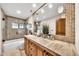 Bathroom with stylish tile and updated fixtures, vanity with stone countertop at 4022 E Stanford Dr, Phoenix, AZ 85018