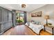 Cozy bedroom with a backyard view and stylish hardwood floors at 4022 E Stanford Dr, Phoenix, AZ 85018