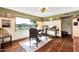 Bright dining area with large windows offering a view of the outdoors at 4022 E Stanford Dr, Phoenix, AZ 85018