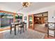 Dining area features tile flooring, backyard views, and an open flow into the living room at 4022 E Stanford Dr, Phoenix, AZ 85018