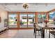 Bright dining area featuring tile flooring, backyard views, and a decorative ceiling fan at 4022 E Stanford Dr, Phoenix, AZ 85018