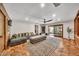 Bright and airy living room with tiled floors, and sliding glass doors to the outdoor patio area at 4022 E Stanford Dr, Phoenix, AZ 85018