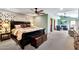 Main bedroom featuring a tray ceiling, a ceiling fan, and an ensuite sitting room at 4022 E Stanford Dr, Phoenix, AZ 85018