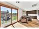 Bright home office with a backyard view and built-in desk and cabinetry at 4022 E Stanford Dr, Phoenix, AZ 85018