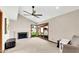 Sitting area with carpeted floors, a ceiling fan, and views to the backyard through sliding glass doors at 4022 E Stanford Dr, Phoenix, AZ 85018