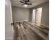 Spacious bedroom with wood-look flooring and ceiling fan at 409 W Pontiac Dr # 8, Phoenix, AZ 85027