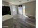 Dining area with wood-look flooring and sliding glass door at 409 W Pontiac Dr # 8, Phoenix, AZ 85027