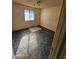 Small bedroom with carpeted floor and a window at 4132 N 89Th Ln, Phoenix, AZ 85037