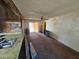 Living room with wood-paneled walls and carpeted floors at 4132 N 89Th Ln, Phoenix, AZ 85037