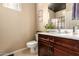 Cozy bathroom with a dark wood vanity and decorative accents at 42424 N Gavilan Peak Pkwy # 23102, Anthem, AZ 85086