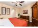 Spacious main bedroom showcasing wooden furnishings and neutral wall color at 42424 N Gavilan Peak Pkwy # 23102, Anthem, AZ 85086