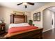 Elegant main bedroom featuring a large bed, wooden furniture, and tasteful decor at 42424 N Gavilan Peak Pkwy # 23102, Anthem, AZ 85086