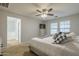 Main bedroom with ensuite bathroom and stylish bedding at 4627 S Grenoble Cir, Mesa, AZ 85212