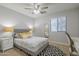 Bedroom with a queen bed, nightstands, and ceiling fan at 4627 S Grenoble Cir, Mesa, AZ 85212