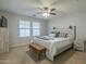 Bright bedroom with a queen-size bed and ample natural light at 4627 S Grenoble Cir, Mesa, AZ 85212