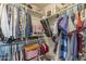 Well-organized closet with hanging clothes and shelves at 4627 S Grenoble Cir, Mesa, AZ 85212