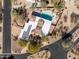 Bird's-eye view of house, pool, and spa; solar panels on the roof at 4706 E Rancho Caliente Dr, Cave Creek, AZ 85331