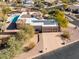 Aerial view of a house with pool and solar panels at 4706 E Rancho Caliente Dr, Cave Creek, AZ 85331