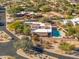 Property with pool and spa, surrounded by desert landscape, distant mountains at 4706 E Rancho Caliente Dr, Cave Creek, AZ 85331