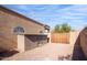 Landscaped backyard with storage shed and gated access at 4706 E Rancho Caliente Dr, Cave Creek, AZ 85331