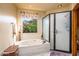 Relaxing bathroom with soaking tub and large window at 4706 E Rancho Caliente Dr, Cave Creek, AZ 85331