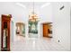 Bright entryway with tile floors and large chandelier at 4706 E Rancho Caliente Dr, Cave Creek, AZ 85331