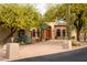 Two-story home with a large front yard and mature trees at 4706 E Rancho Caliente Dr, Cave Creek, AZ 85331