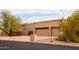 Two-car garage with driveway and desert landscaping at 4706 E Rancho Caliente Dr, Cave Creek, AZ 85331