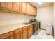 Laundry room with built-in cabinets and a utility sink at 4706 E Rancho Caliente Dr, Cave Creek, AZ 85331