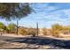 Property view from the street, showcasing the desert landscape at 4706 E Rancho Caliente Dr, Cave Creek, AZ 85331