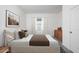 Bedroom with a brown bed, neutral wall tones, and window coverings at 47665 W Cansados Rd, Maricopa, AZ 85139