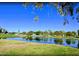 Peaceful golf course view with a pond and lush greenery at 4829 E Lake Point Cir, Phoenix, AZ 85044