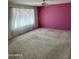 Spacious living room featuring a ceiling fan and large window at 4829 E Lake Point Cir, Phoenix, AZ 85044