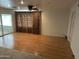 Living room with hardwood floors and large window at 4829 E Lake Point Cir, Phoenix, AZ 85044