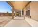 Covered patio extending from the house into backyard at 5211 W Maldonado Rd, Laveen, AZ 85339