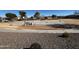 Outdoor basketball court with benches, goals, and surrounding desert landscaping at 5211 W Maldonado Rd, Laveen, AZ 85339