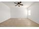 Spacious bedroom featuring a ceiling fan and large window at 5211 W Maldonado Rd, Laveen, AZ 85339