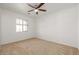 Well-lit bedroom with ceiling fan and window at 5211 W Maldonado Rd, Laveen, AZ 85339