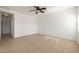 Bright bedroom with ceiling fan and carpet flooring at 5211 W Maldonado Rd, Laveen, AZ 85339