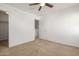 Bright bedroom with double closets and ceiling fan at 5211 W Maldonado Rd, Laveen, AZ 85339