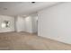 Bright living room with neutral walls and carpeted floors at 5211 W Maldonado Rd, Laveen, AZ 85339